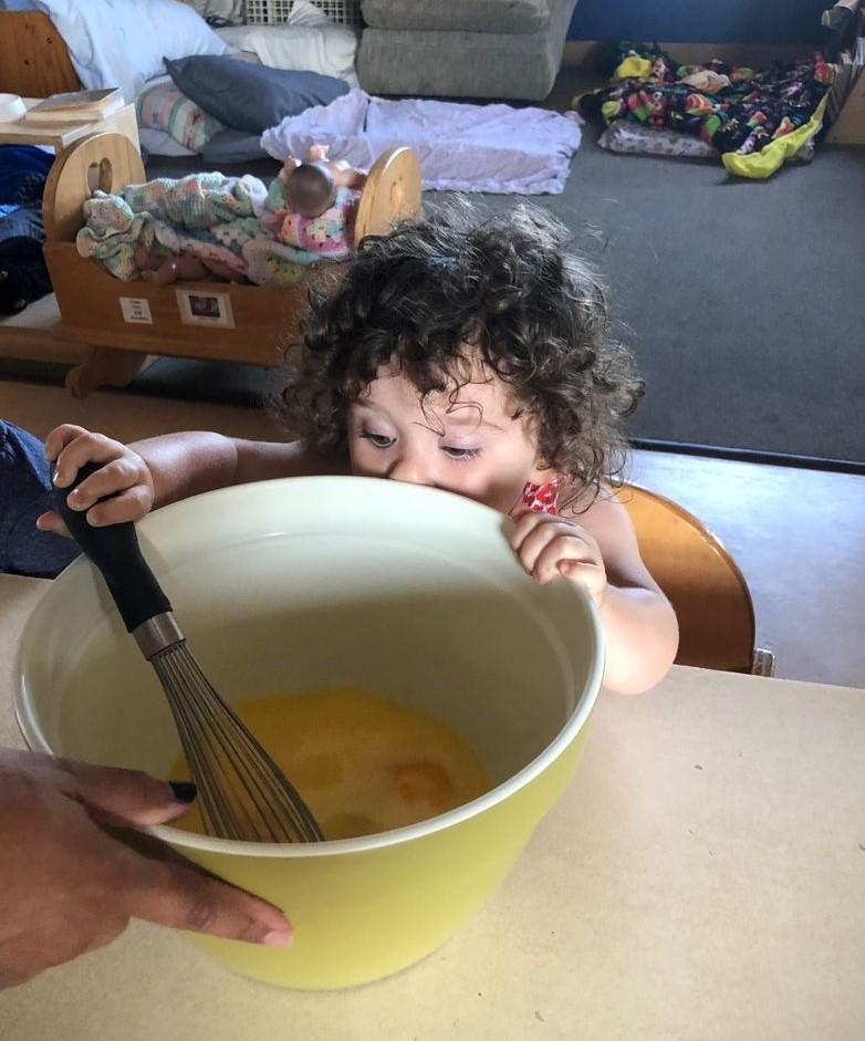 Toddler mixing during cooking project